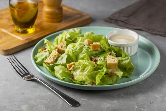 Caesar salad with croutons and bacon.