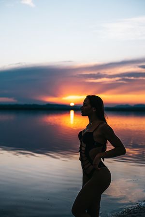 woman against sunset sky on beach