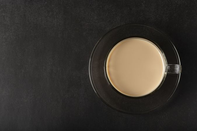 Cup of coffee with creamy milk.