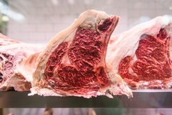 Raw meat on a butcher's chiller for maturing