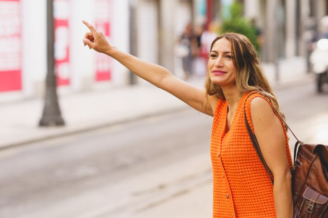 Woman hailing taxi