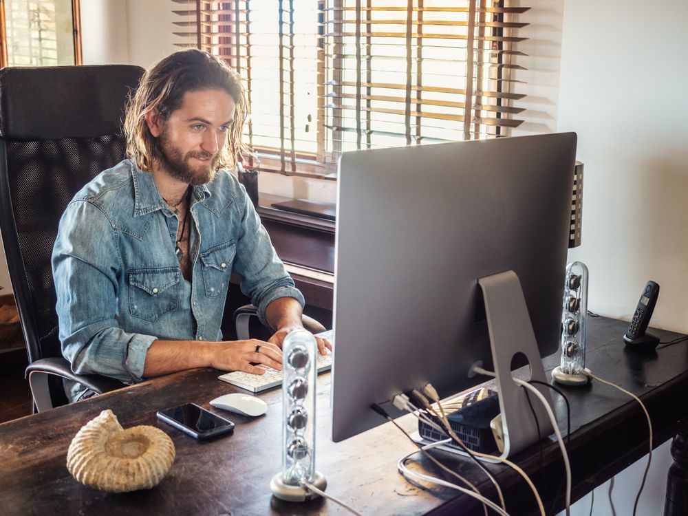 Man using computer in apartment