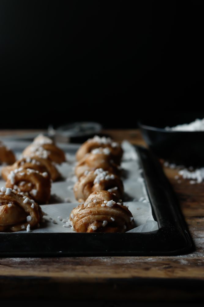 Sugar and cutter near cardamom buns