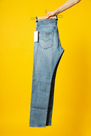 jeans with tags on hangers