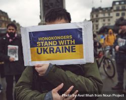 London, England, United Kingdom - March 5 2022: Man with face behind sign supporting Ukraine 5aqWv5