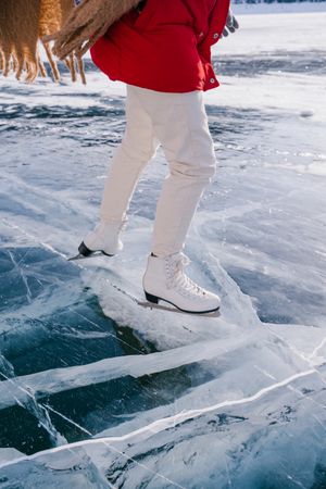 Woman skating on frozen river