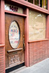 Pub closed for social distancing restrictions with hand-written words “God Bless America” on it