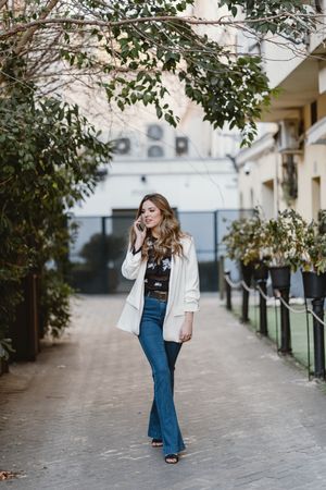 Woman talking phone on street