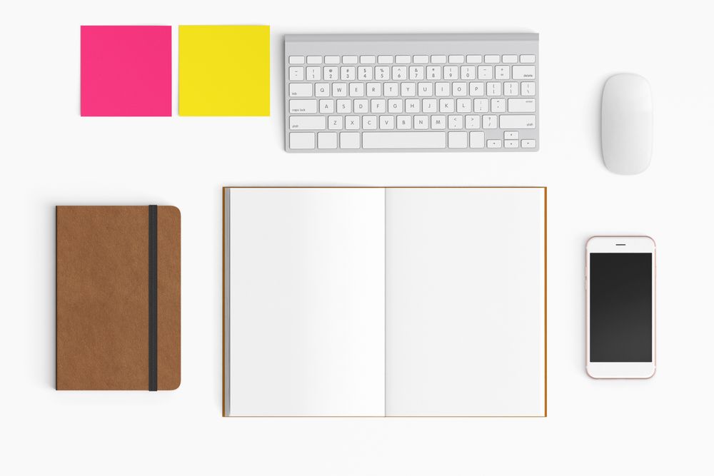 Modern workspace with coffee cup, smartphone, paper, notebook, tablet and laptop