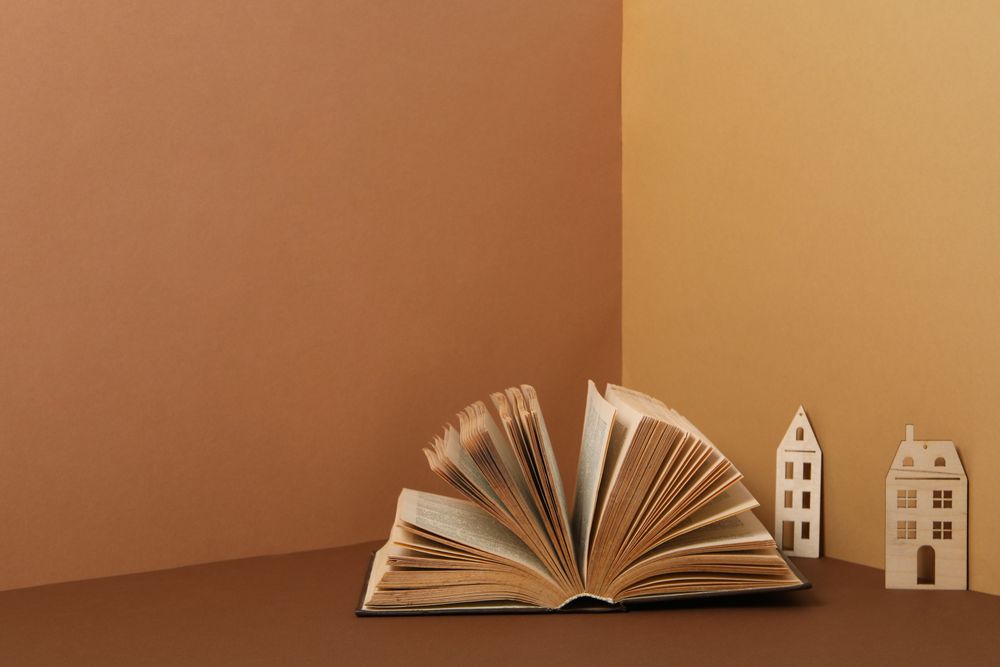 A children's book with toys on a beige background.