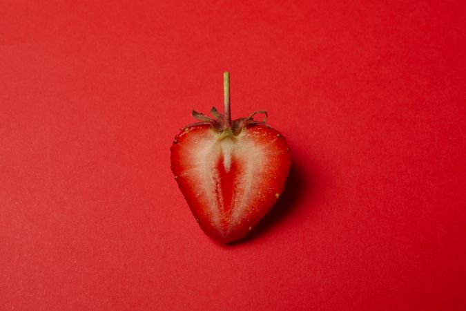 Tasty strawberry on red background. Summer berry