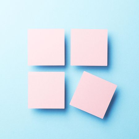 Four pink squares on blue background