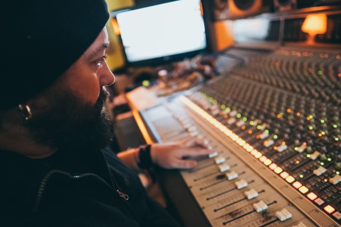 Man in a equalizer instrument in a studio