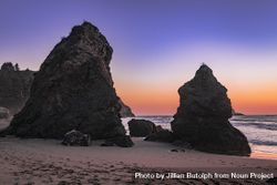Sunset over Pacific Ocean seen from rocky beach 5wERRb