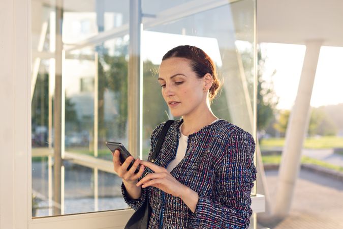 Smiling businesswoman answering phone call
