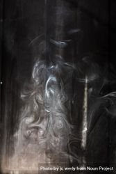 Swirls of smoke in a dark room 5wyO1b