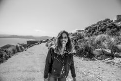 Smiling female on seashore