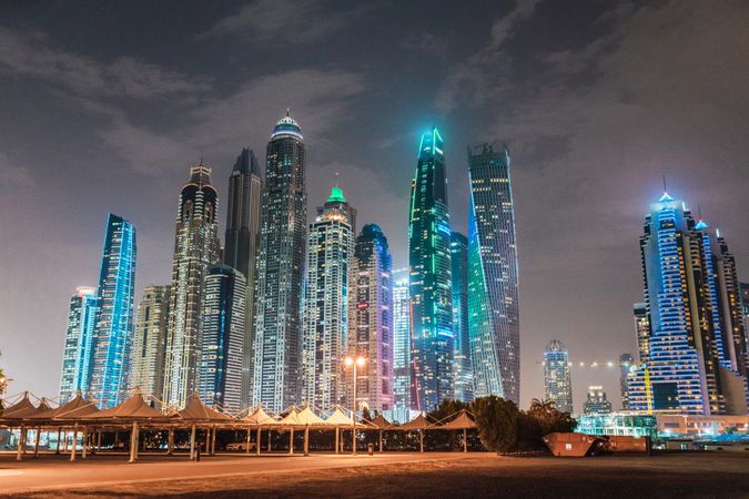 Cloudy sky over illuminated metropolis