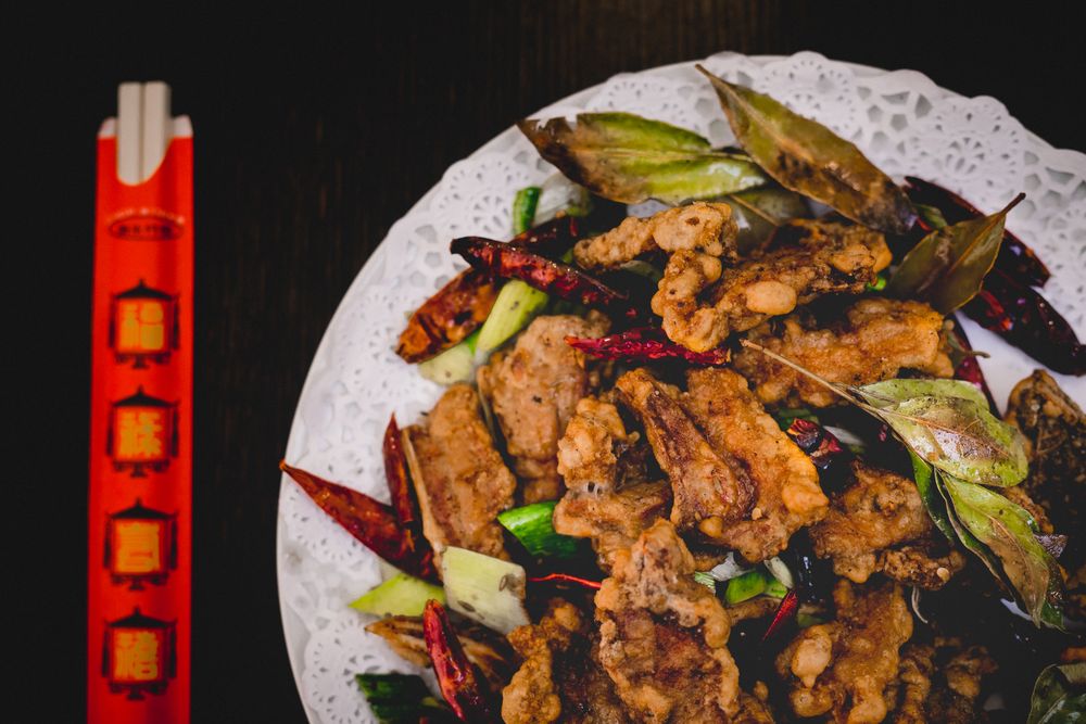 Served delicious spicy lamb in Asian restaurant