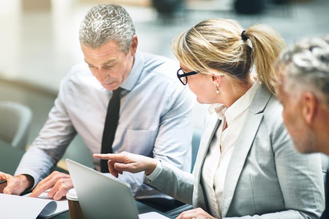 Colleagues discussing a matter during a meeting