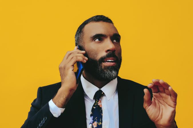 Calm Black businessman having a call on a smartphone screen