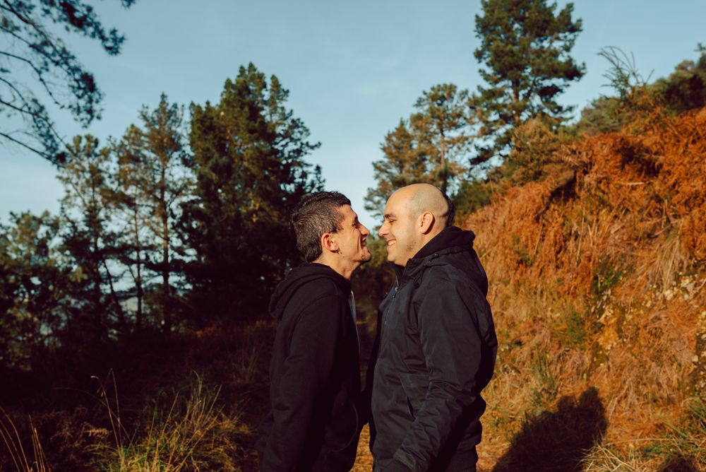 Men kissing in park