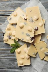 Baking paper with light chocolate and mint on gray wooden table
