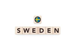 Wooden blocks bearing the name and flag of Sweden.