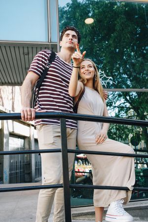 Young tourists couple standing outdoors