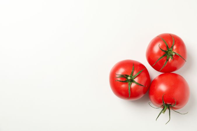 Fresh ripe tomatoes on neutral background, top view