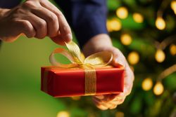Man Holding Christmas Gift Box