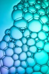 Abstract background bio technology, macro photography foam and water with gradient background. Molecule multicolor backgorund