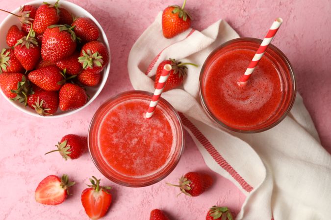 Composition with strawberry cocktails on pink table. Summer drink