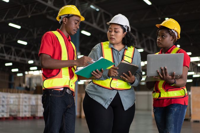 Group of logistic staff working at warehouse