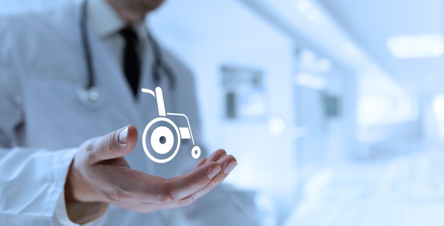 Doctor Reveals Wheelchair Icon in Palm