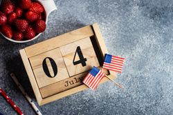 Independence Day celebration snack of strawberries on grey counter with copy space