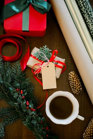 Christmas presents and coffee on wooden table