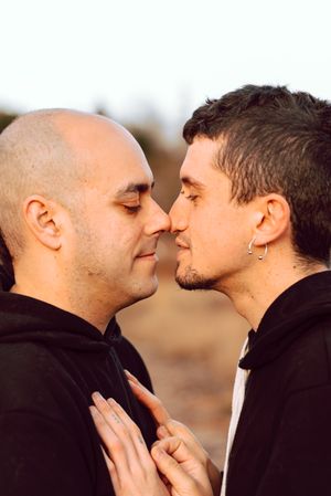 Men hugging in forest