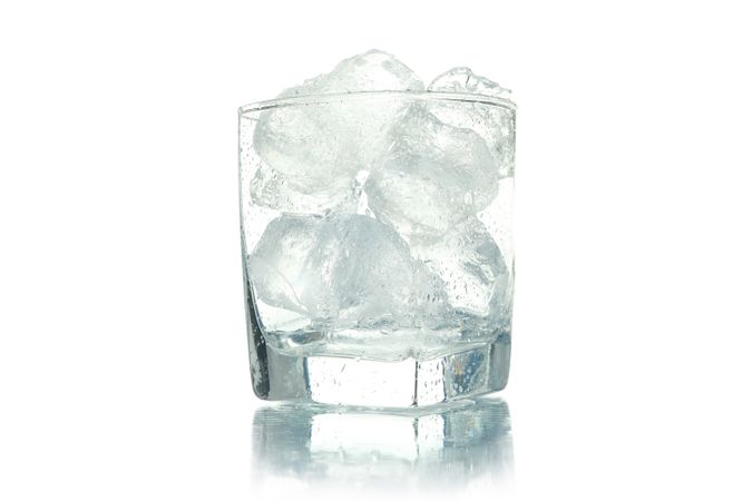 Square rocks glass full of ice, copy space
