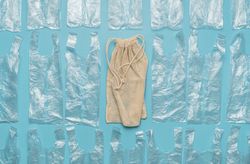 Flat lay with plastic bags and one reusable bag