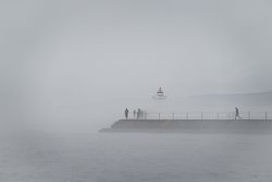 People emerged in fog on the way to a lighthouse on Lake Superior, Minnesota