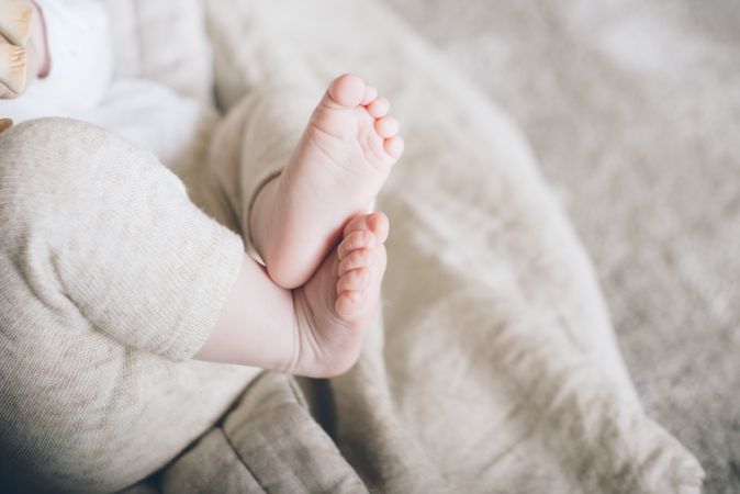 Charming cute baby feet and fingers of new born