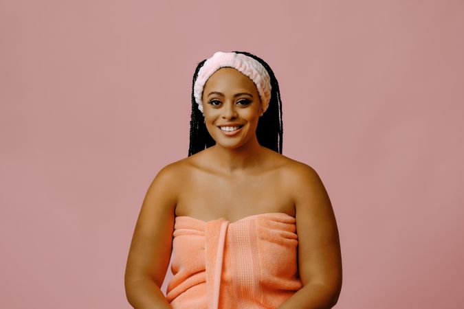 Female in towel with her hair kept back in spa headband