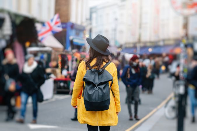 Unrecognizable tourist walking on street during festival