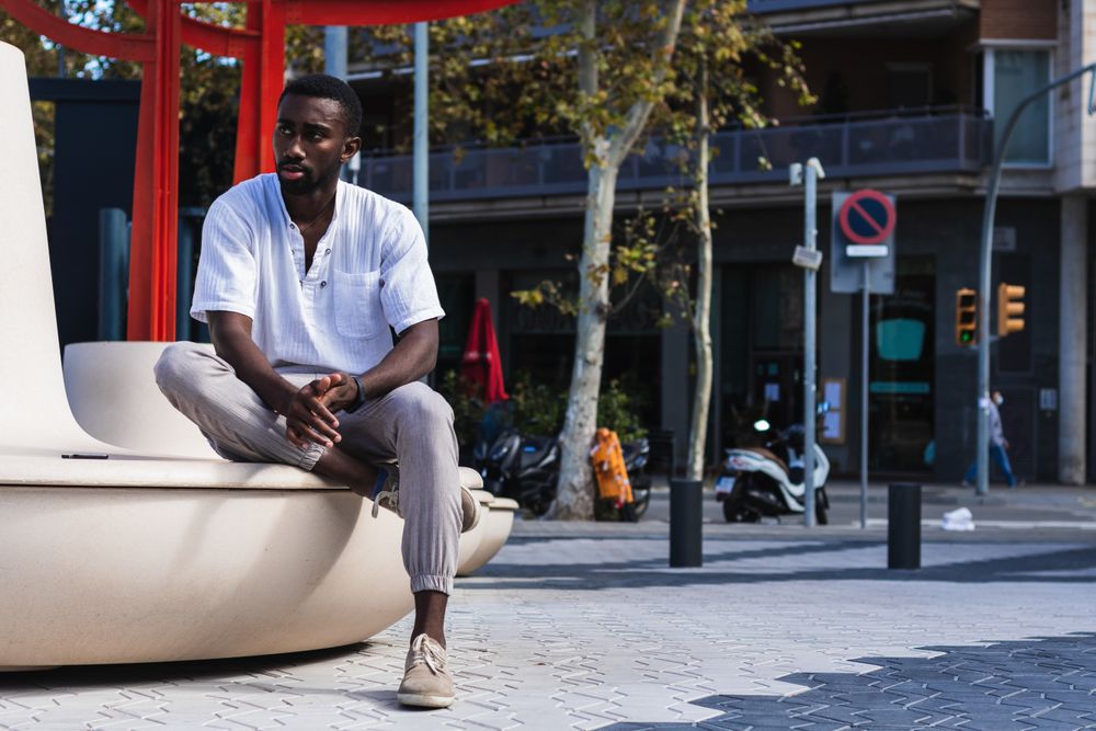 Stylish Black man in city street