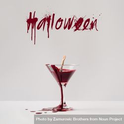 Doll hand drowning in martini glass full of blood with “Halloween” text 0ywZj4