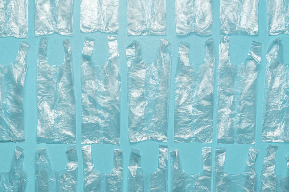 Plastic bags aligned on a blue background