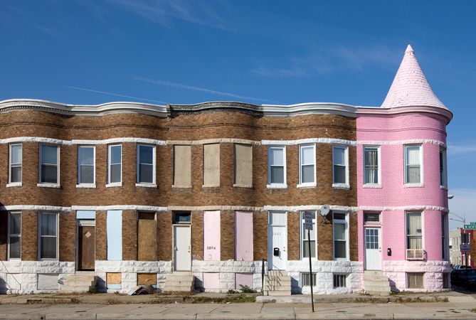 Row of houses, one pink, Baltimore, Maryland