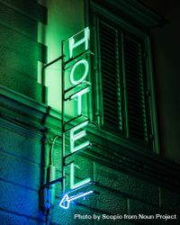 Hotel green neon signage at night 0WLdx5