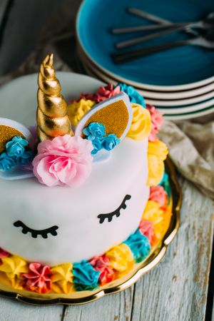 Cute unicorn cake with painted closed eyes